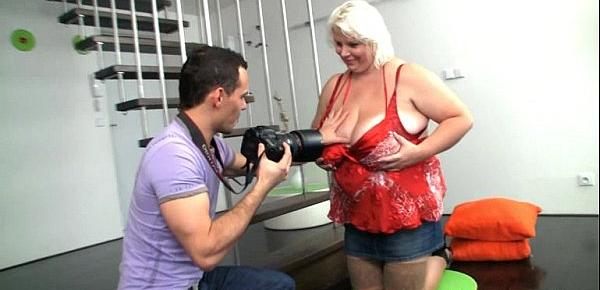  Shooting pics of her huge boobs turns him on